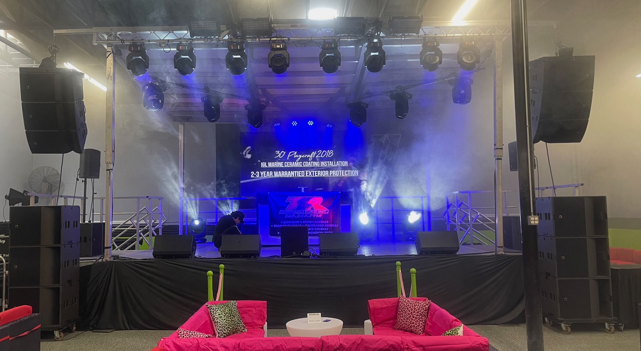 SL50 stage set up indoors with lighting and sound equipment